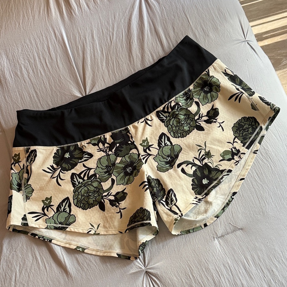 Oiselle Cream, Black, and Green Floral Roga Shorts